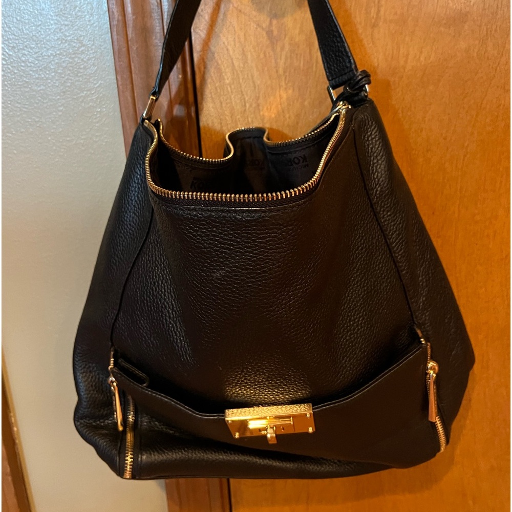 Black bag with gold hardware.